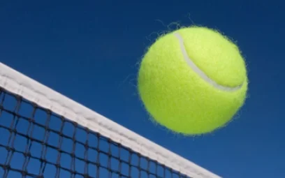 Tennis ball clearing the net