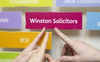 Leeds Mencap presented Winston Solicitors with their supporters brick