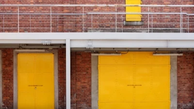 yellow shutters outside a commercial building