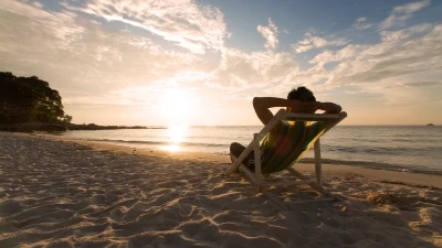 Holiday entitlement changes due to covid19 person sitting on a beach