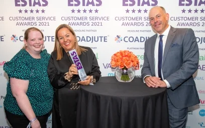 Leasa Foster and Samantha Robertson-Strong of Winston Solicitors collect their ESTAS award from Phil Spencer