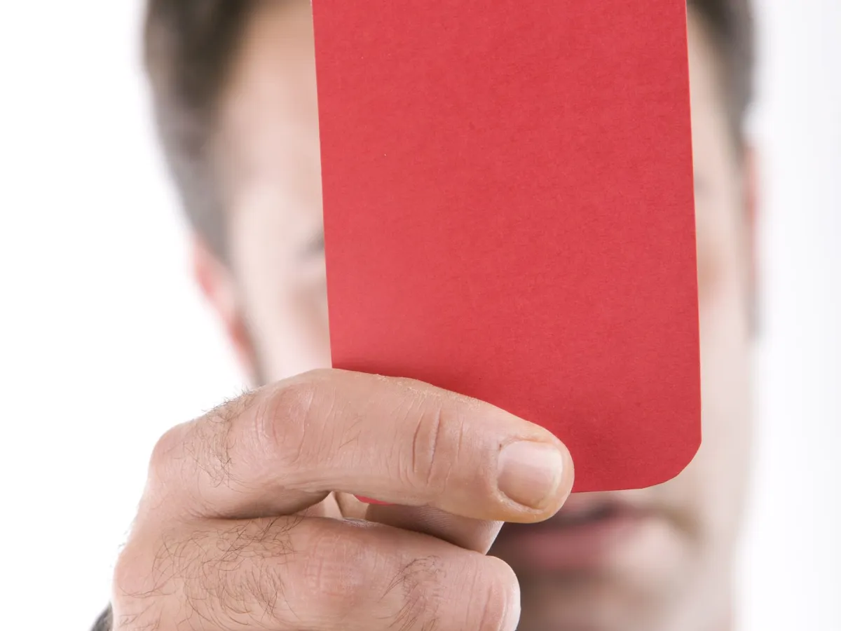 Referee holds up red card in Mourinho sacking case Referee holds up red card in Mourinho sacking case