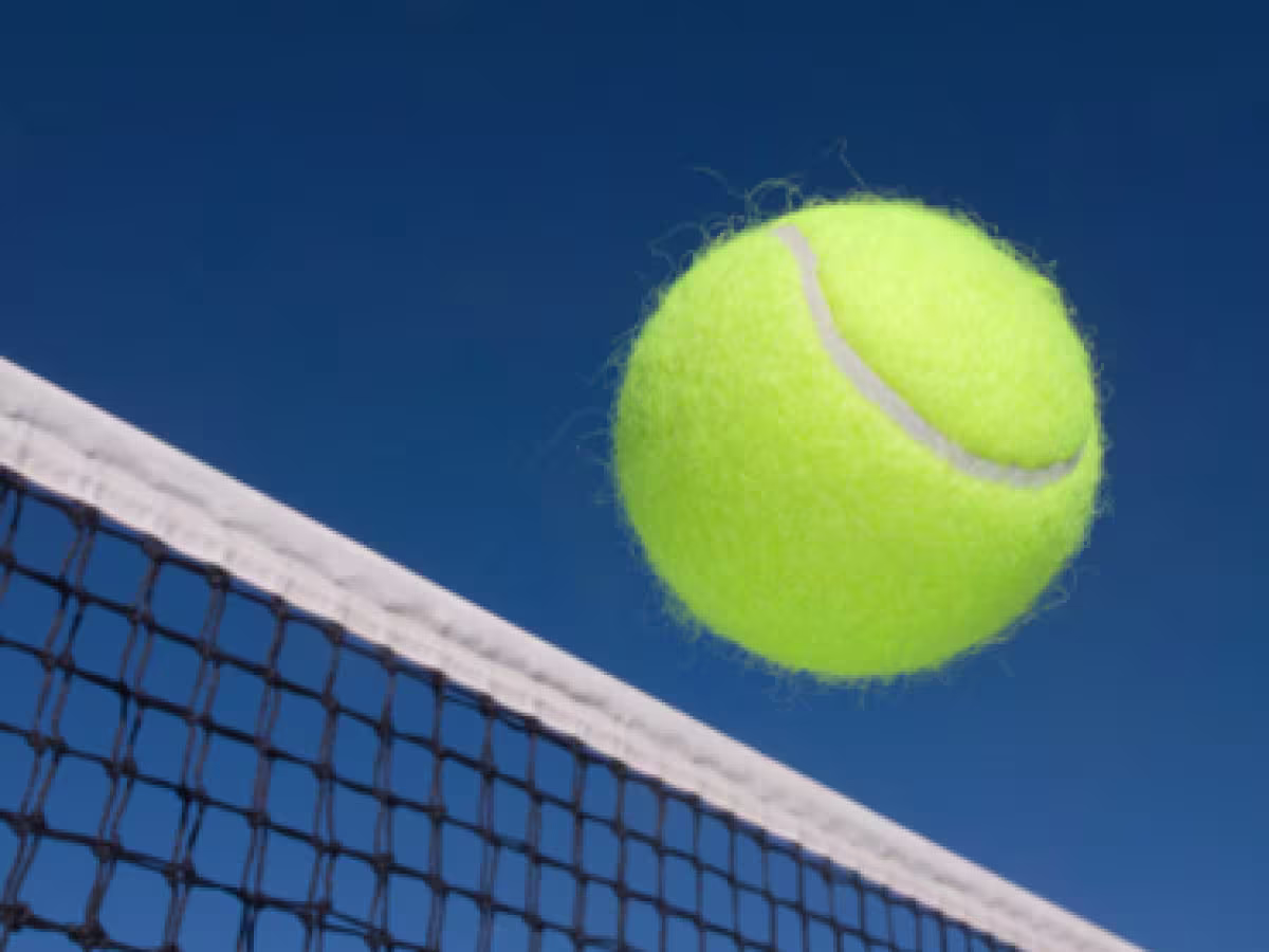 Tennis ball clearing the net
