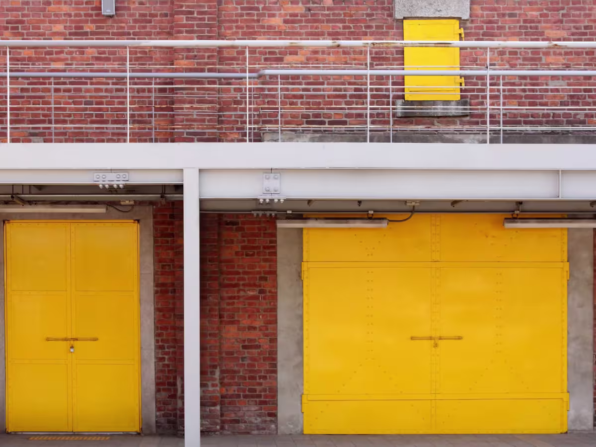 yellow shutters outside a commercial building