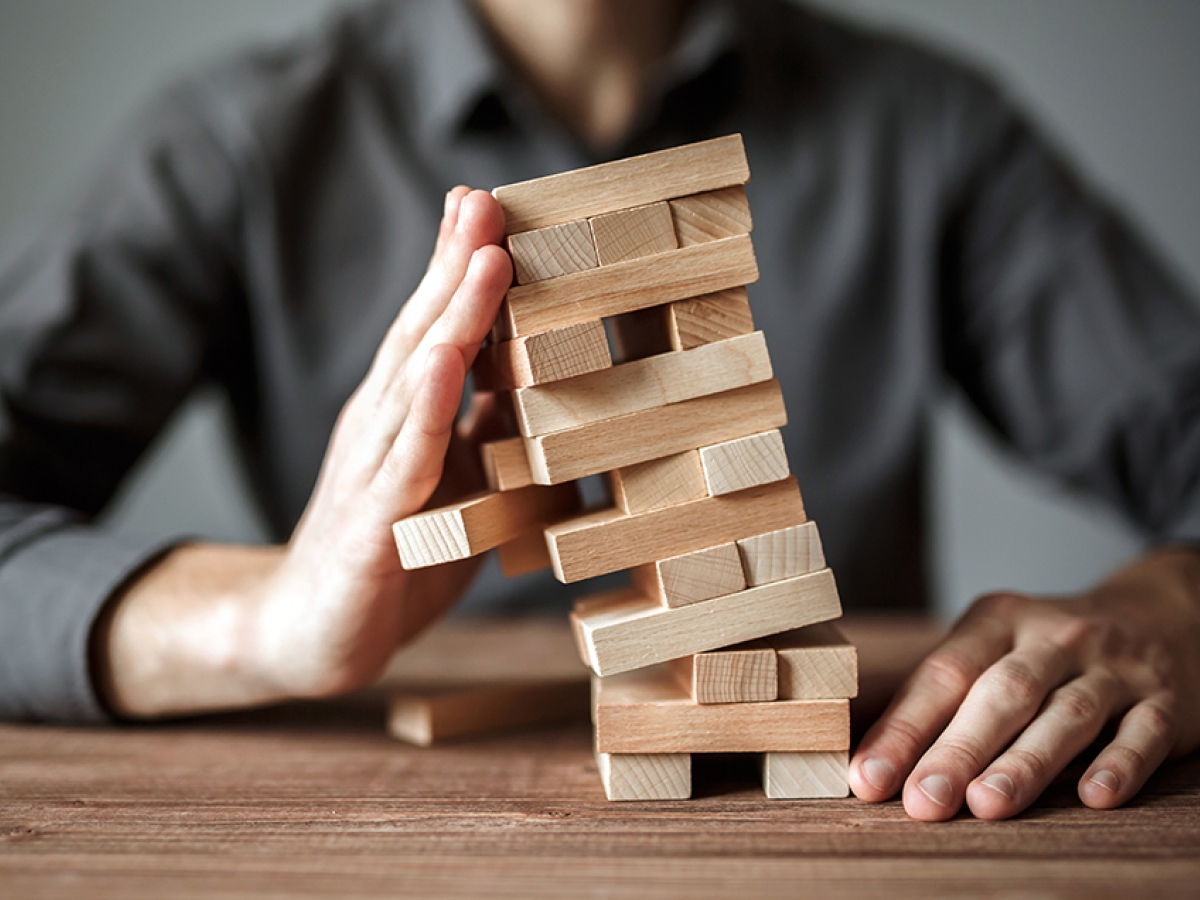 hand stopping tumbling blocks hand stopping tumbling blocks