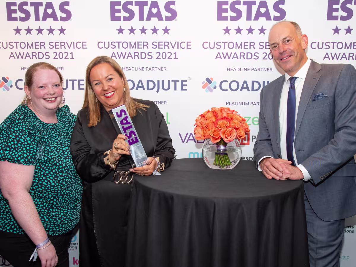 Leasa Foster and Samantha Robertson-Strong of Winston Solicitors collect their ESTAS award from Phil Spencer