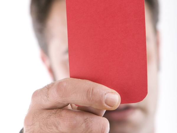 Referee holds up red card in Mourinho sacking case