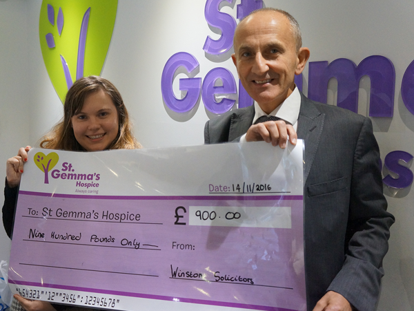 Howard Cohen presenting a cheque to St Gemmas for Make A Will Month