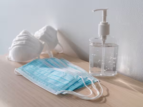 covid safe face mask and hand gel