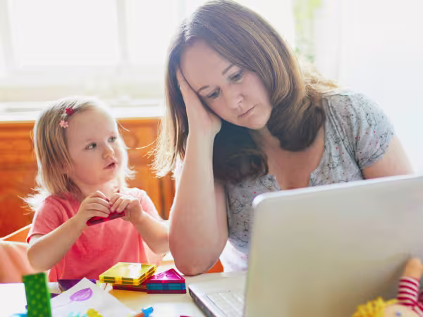 mother working from home looking after child