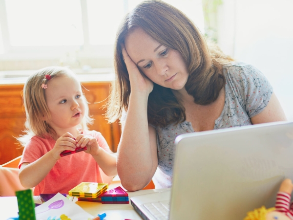 mother working from home looking after child