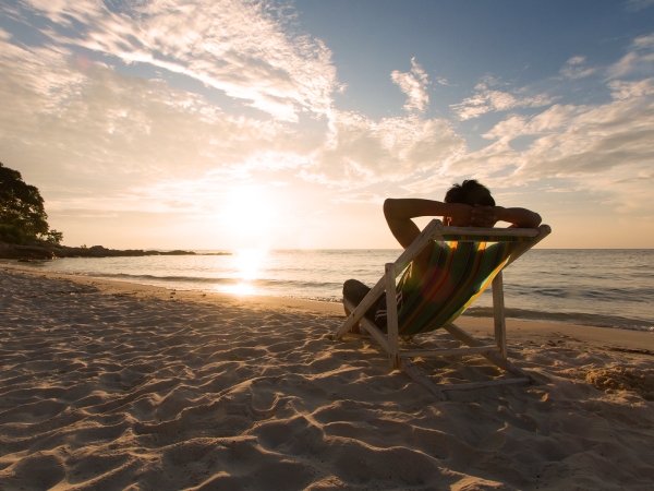 Holiday entitlement changes due to covid19 person sitting on a beach