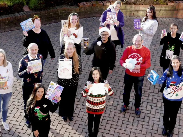 Festive Christmas jumpers ready to deliver our gifts for Cash For Kids Mission Christmas