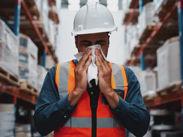 Problem with being ill at work manager sneezing in a warehouse