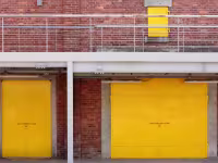 yellow shutters outside a commercial building